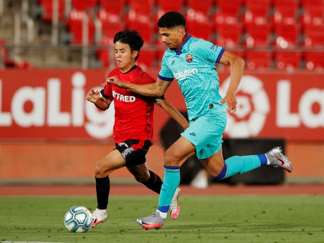 Barcelona defender Ronald Araujo in action with Mallorca's Takefusa Kubo in June 2020
