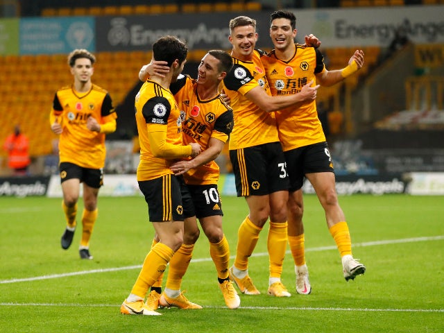 Daniel Podence celebrates scoring for Wolverhampton Wanderers against Crystal Palace with teammates in the Premier League on October 30, 2020