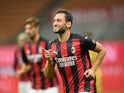 Hakan Calhanoglu celebrates scoring for Milan on September 24, 2020