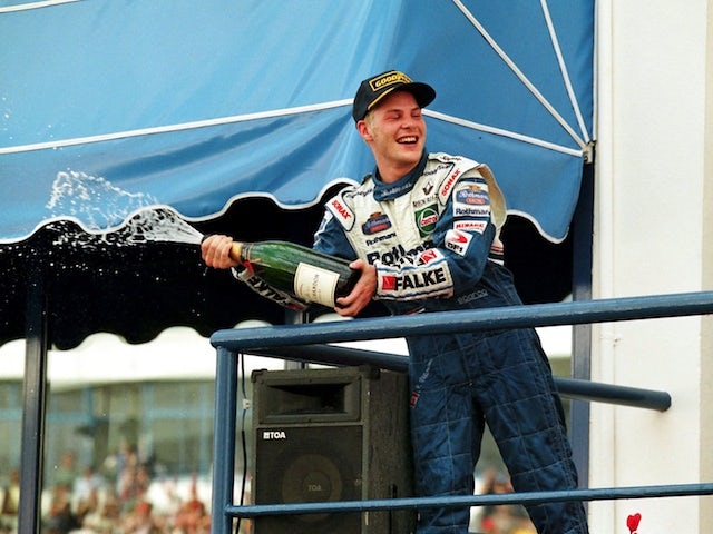 Jacques Villeneuve celebrates winning the 1997 F1 world title