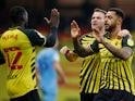 Andre Gray celebrates with teammates after scoring for Watford against Coventry City in the Championship on November 7, 2020