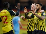 Andre Gray celebrates with teammates after scoring for Watford against Coventry City in the Championship on November 7, 2020