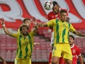 Tondela players challenge for the all against Benfica in June 2020