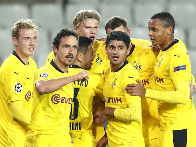Borussia Dortmund's Erling Braut Haaland celebrates with teammates after scoring against Club Brugge on November 4, 2020