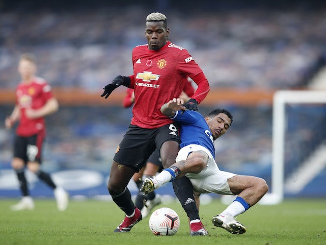Manchester United's Paul Pogba in action with Everton's Allan in the Premier League on November 7, 2020