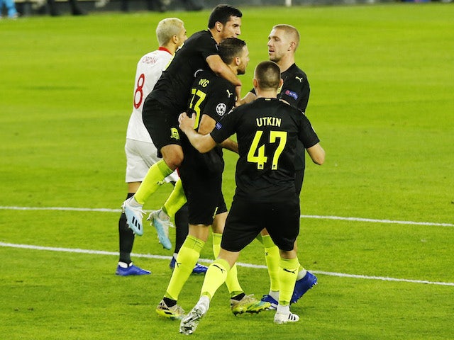 Krasnodar's Marcus Berg celebrates with teammates after scoring against Sevilla on November 4, 2020
