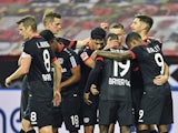 Bayer Leverkusen players celebrate Lucas Alario's goal against Borussia Monchengladbach on November 8, 2020