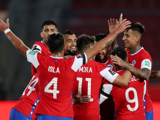 Chile players celebrate scoring against Peru on November 13, 2020