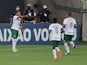 Goias's Vinicius Lopes celebrates with teammates after scoring in October 2020