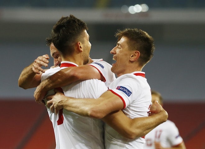 Poland players celebrate scoring against Ukraine on November 11, 2020