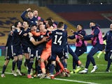 Scotland players celebrate after beating Serbia on penalties in their Euro 2020 playoff on November 12, 2020