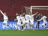 Serbia players celebrate scoring against Scotland on November 13, 2020