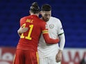 Wales' Gareth Bale and Republic of Ireland's Matt Doherty embrace after the UEFA Nations League clash on November 15, 2020