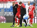 Bayern Munich defender Alphonso Davies is carried off injury in October 2020