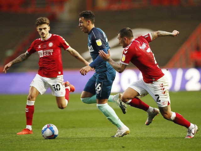 Derby County's Lee Buchanan in action with Bristol City's Jamie Paterson and Jack Hunt on November 21, 2020