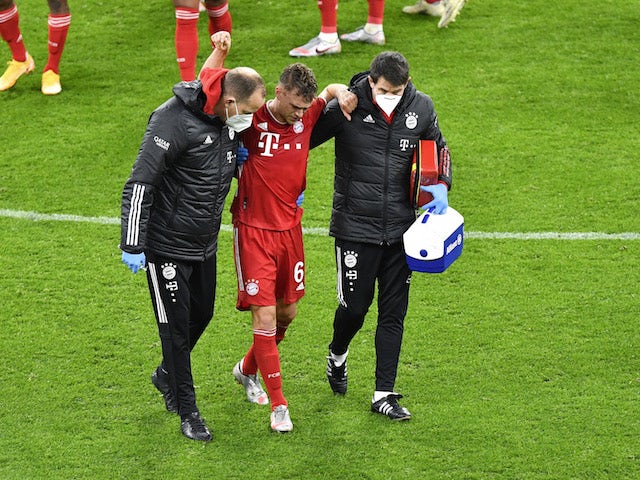 Bayern Munich's Joshua Kimmich is helped off after picking up an injury in November 2020