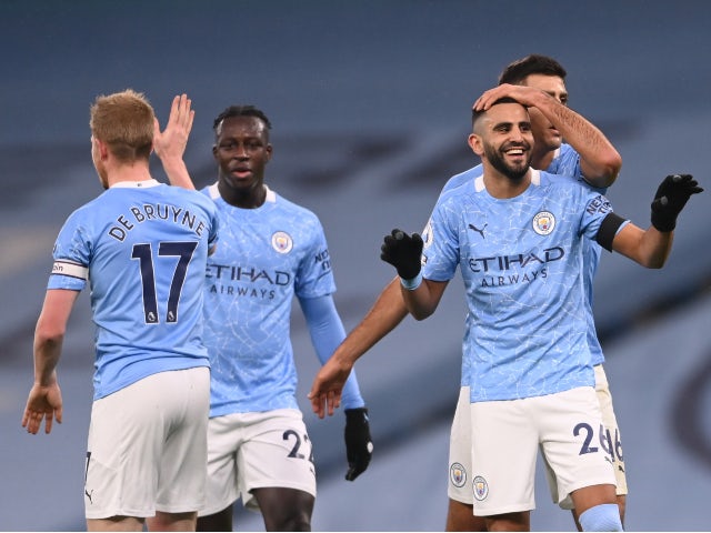 Riyad Mahrez celebrates with teammates after scoring for Manchester City against Burnley in the Premier League on November 28, 2020