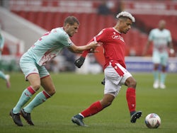 Nottingham Forest's Lyle Taylor in action with Swansea City's Ryan Bennett in the Championship on November 29, 2020