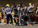 Romain Grosjean is helped away after his horror crash at the Bahrain Grand Prix on November 29, 2020