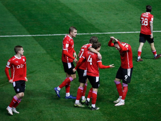 Callum Styles celebrates with teammates after scoring for Barnsley against Birmingham City in the Championship on December 1, 2020