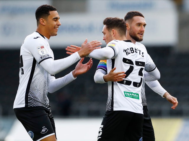 Connor Roberts celebrates scoring for Swansea City against Luton Town in the Championship on December 5, 2020