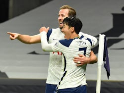 Tottenham Hotspur's Harry Kane celebrates with Son Heung-min after scoring against Arsenal in the Premier League on December 6, 2020
