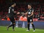 Burnley's Ashley Westwood and Dwight McNeil celebrate an own goal against Arsenal on December 13, 2020