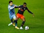 Coventry City's Tyler Walker in action with Luton Town's Pelly-Ruddock Mpanzu in the Championship on December 8, 2020.