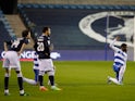 QPR players take a knee while Millwall players stand in the Championship on December 8, 2020