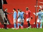 Manchester City's Joao Cancelo and teammates remonstrate with referee Chris Kavanagh against Manchester United in the Premier League on December 12, 2020