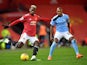 Manchester United's Paul Pogba in action with Manchester City's Fernandinho in the Premier League on December 12, 2020