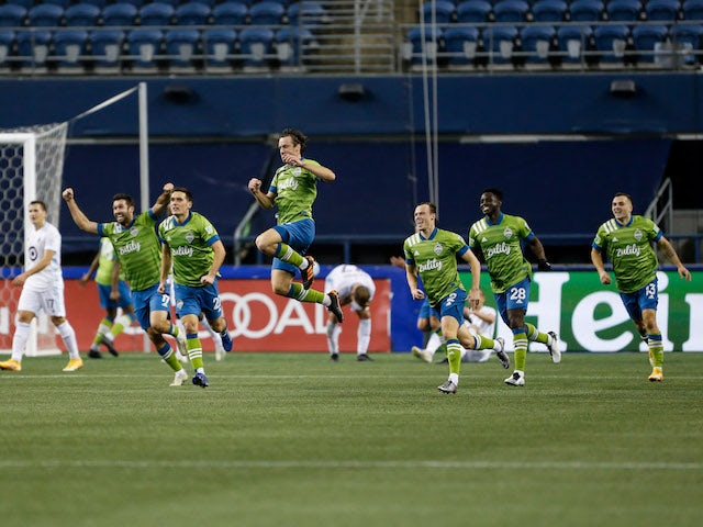 Seattle Sounders players celebrate winning the Western Conference in December 2020