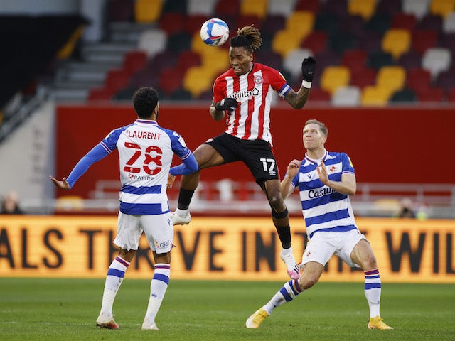 Brentford's Ivan Toney in action with Reading's Josh Laurent and Michael Morrison on December 19, 2020