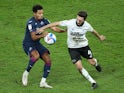 Derby County's Graeme Shinnie in action with Swansea City's Korey Smith in the Championship on December 16, 2020