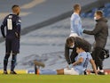 Manchester City defender Eric Garcia receives treatment for an injury in December 2020