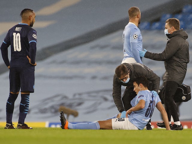 Manchester City defender Eric Garcia receives treatment for an injury in December 2020