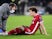 Liverpool's Kostas Konstantinos Tsimikas receives treatment for an injury in December 2020