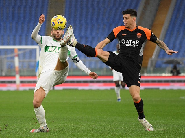 Sassuolo's Domenico Berardi in action with Roma's Roger Ibanez in Serie A on December 6, 2020