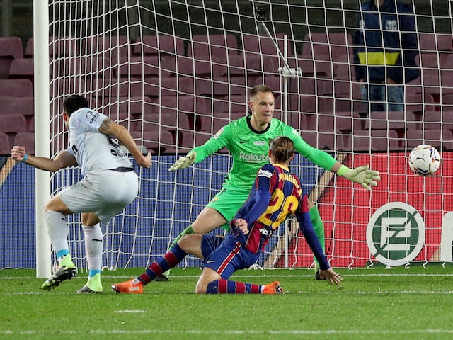 Valencia's Maxi Gomez scores their second goal against Barcelona on December 19, 2020