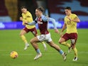 Aston Villa's Jack Grealish in action with Burnley's Ashley Westwood in the Premier League on December 17, 2020
