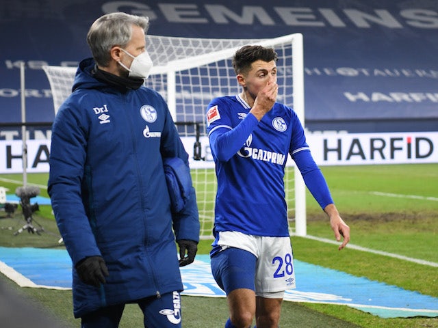 Schalke 04's Alessandro Schopf comes off as a substitute after sustaining an injury on January 9, 2021
