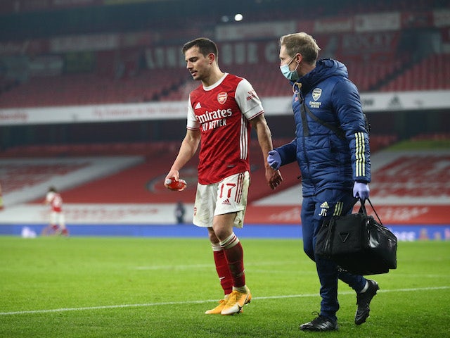 Arsenal defender Cedric Soares receives treatment after an injury on January 9, 2021