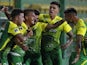 Defensa y Justicia's Brian Romero celebrates scoring their first goal against Bahia with teammates in December 2020