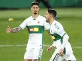 Elche's Fidel celebrates scoring their first goal with teammates against Real Madrid on December 30, 2020
