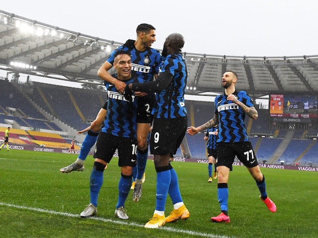 Inter Milan's Achraf Hakimi celebrates scoring their second goal with Lautaro Martinez and Romelu Lukaku on January 10, 2021