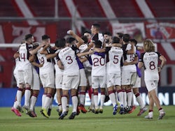 Lanus players celebrate after the match against Independiente in December 2020