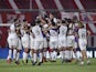 Lanus players celebrate after the match against Independiente in December 2020