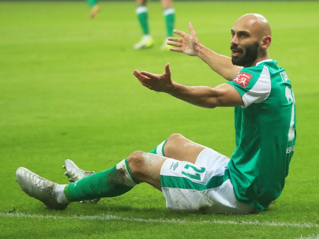 Werder Bremen's Omer Toprak reacts on the ground on January 9, 2021