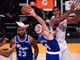 Los Angeles Lakers guard Alex Caruso tips a rebound away from San Antonio Spurs forward LaMarcus Aldridge on January 8, 2021