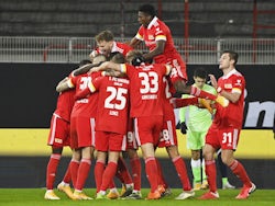 Union Berlin's Robert Andrich celebrates scoring their second goal with teammates on January 9, 2021